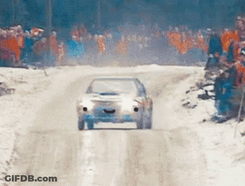 Car Driving Down Snowy Road GIF