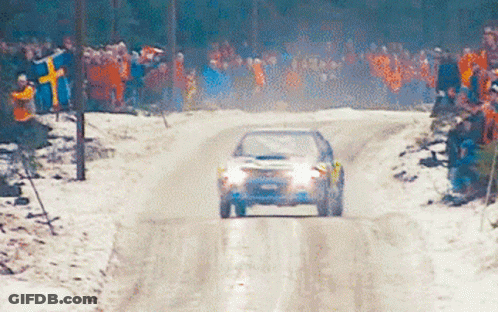 Car Driving Down Snowy Road GIF