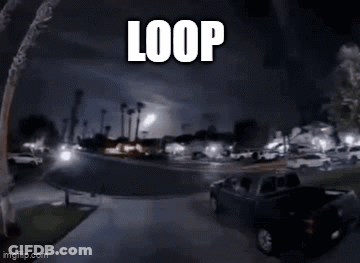 Car Driving Down Street At Night Saying Loop GIF