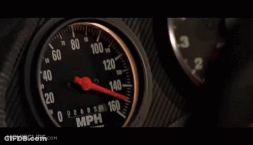 Car Driving Down Street At Night With Blue Lights GIF