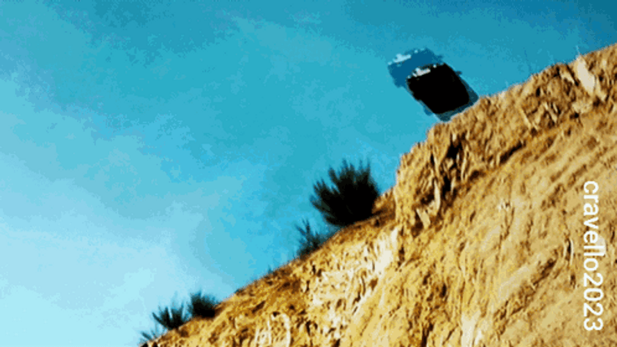 Car Driving Off Cliff And Blowing Up GIF