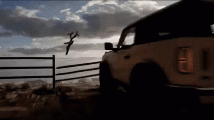 Car Driving Off Cliff During A Race GIF