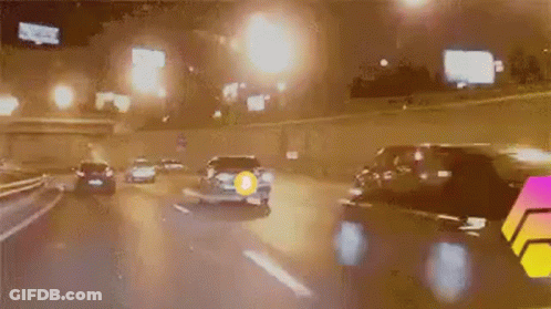 Car Driving On Highway At Night With Yellow Circle GIF