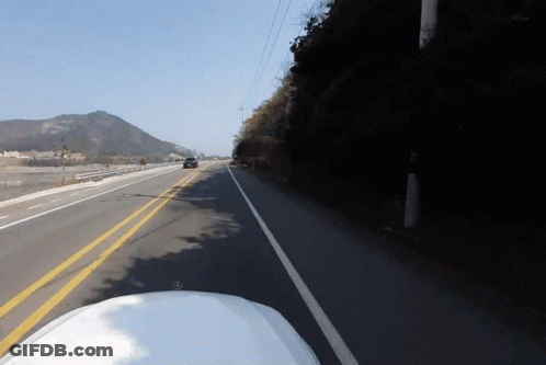 Car Driving On Road With Yellow Line GIF