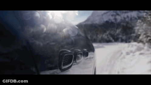 Car Driving On Snow Covered Road GIF