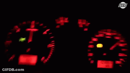 Car Driving On Street With Houses And Roger 5588 Sign GIF