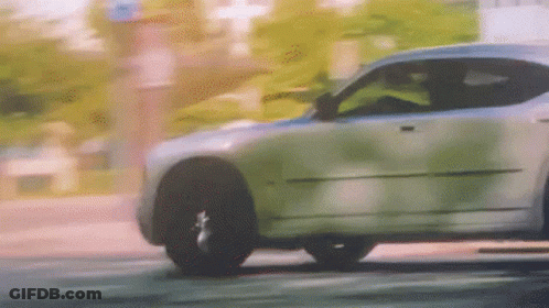Car Driving On Street With Trees GIF