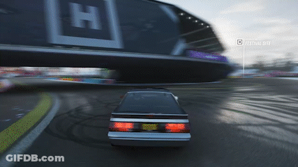 Car Driving Past Billboard Festival Site GIF