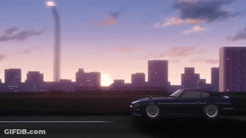 Car Driving Past City Skyline At Sunset GIF
