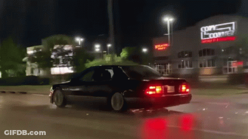Car Driving Past Copy Center GIF