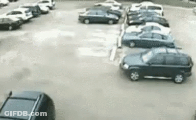 Car Driving Through Parking Lot GIF