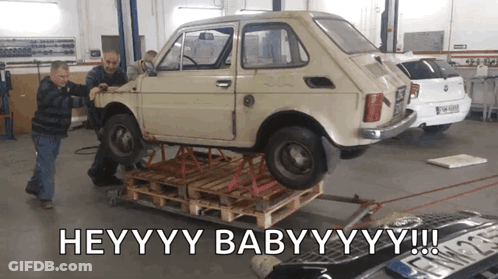 Car On Wooden Pallet Saying Heyyyy Babyyyy GIF