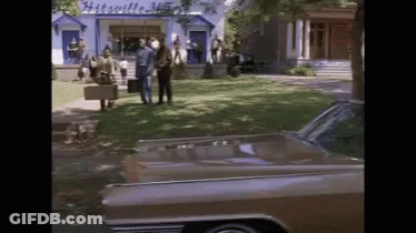 Car Parked In Front Of Mitchell Building GIF