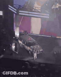 Car Parked On Stage In Front Of Crowd GIF