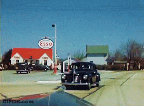 Car Passing Esso Gas Station GIF