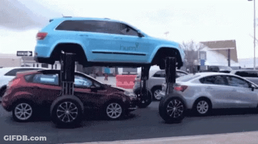Car With Expandable Wheels In Traffic GIF