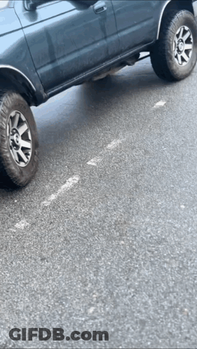 Car With Flat Tire Parked GIF