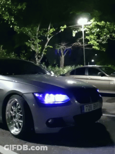 Car With License Plate 728 Parked At Night GIF