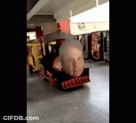 Cardboard Train With Face In Parking Garage GIF