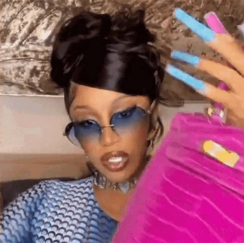 Cardi B Flexing Bags GIF