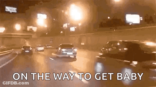 Cars Driving Down Highway At Night On The Way To Get Baby GIF