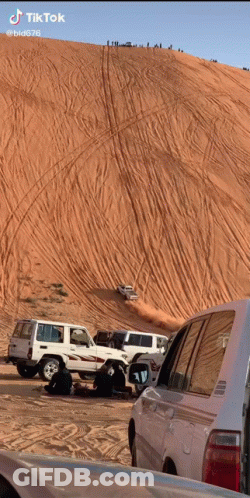 Cars Driving Down Sand Dune GIF