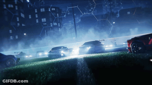 Cars Racing Down Track At Night GIF