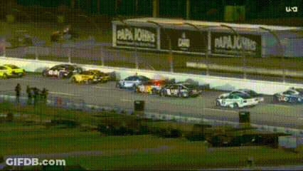 Cars Racing On Race Track At Night GIF