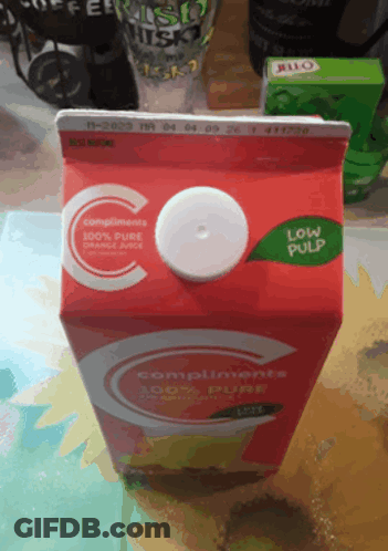 Carton Of Compliments Pure Orange Juice With White Lid GIF
