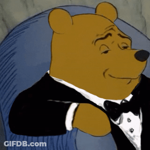 Cartoon Bear In Tuxedo And Bow Tie Sitting In Chair GIF