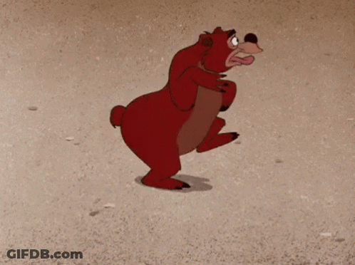 Cartoon Bear On Hind Legs On Sand GIF