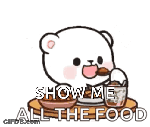 Cartoon Bear Sitting At Table Saying Show Me All The Food GIF