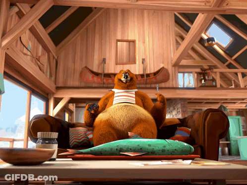 Cartoon Bear Sitting On Couch GIF