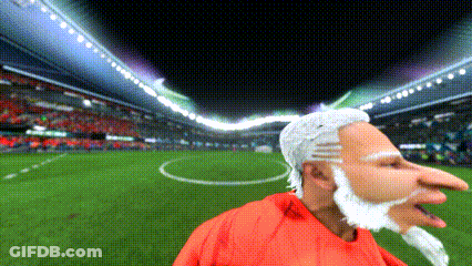 Cartoon Bearded Man In Red Shirt On Soccer Field GIF