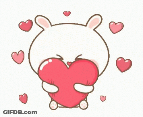 Cartoon Bunny Holding Large Red Heart Surrounded By Hearts GIF