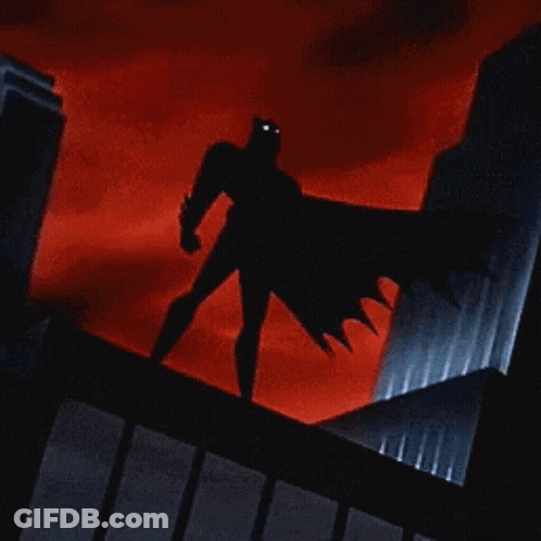Cartoon Cat Dressed As Batman Standing On Building GIF