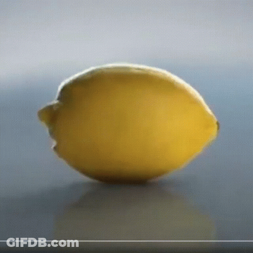 Cartoon Cat Eating Lemon GIF