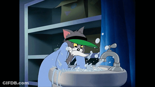 Cartoon Cat In Green Hat Washing Face In Sink GIF