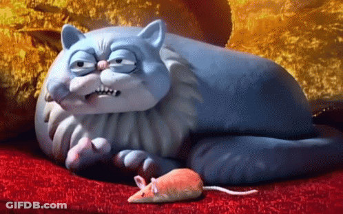 Cartoon Cat Lying On Red Couch Next To Toy Mouse GIF