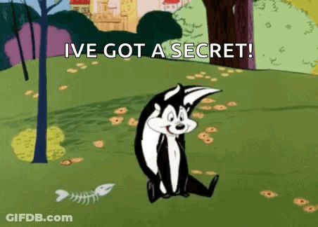 Cartoon Cat Sitting In Grass Saying Ive Got A Secret GIF
