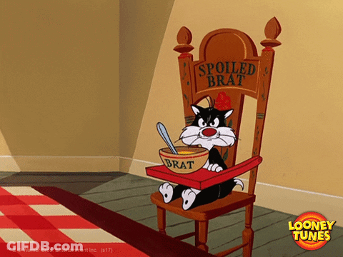 Cartoon Cat Sitting In High Chair With Bowl Of Brat GIF