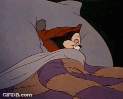 Cartoon Cat Sleeping In Bed With Purple Blanket GIF
