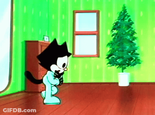 Cartoon Cat Standing By Christmas Tree GIF
