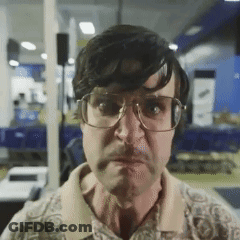 Cartoon Cat Wearing Glasses Making Shhh Sign GIF