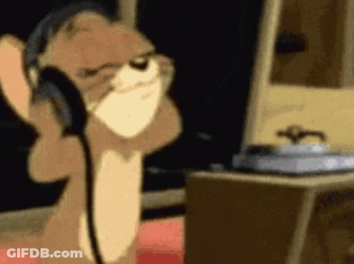 Cartoon Cat Wearing Headphones At Computer GIF