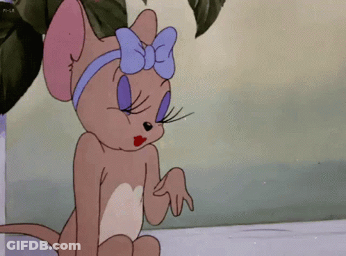 Cartoon Cat With Blue Bow Sitting Down GIF