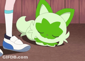 Cartoon Cat With Green Leaves Laying On Floor GIF
