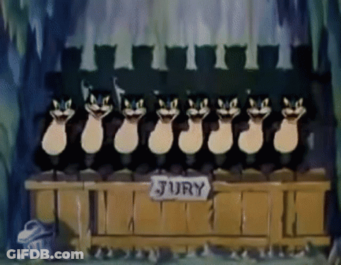 Cartoon Cats Sitting In Front Of Jury Table GIF