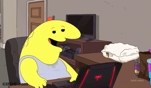 Cartoon Character At Desk With Laptop And TV GIF
