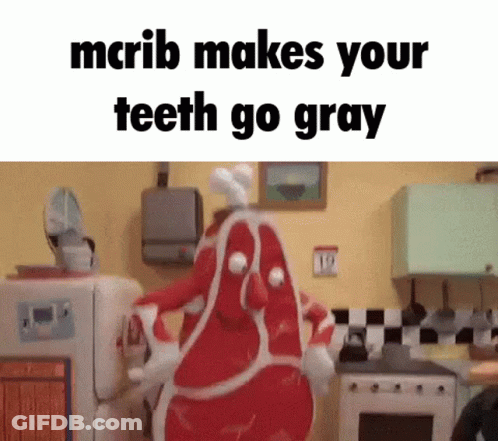 Cartoon Character Dressed As Meat In Kitchen GIF